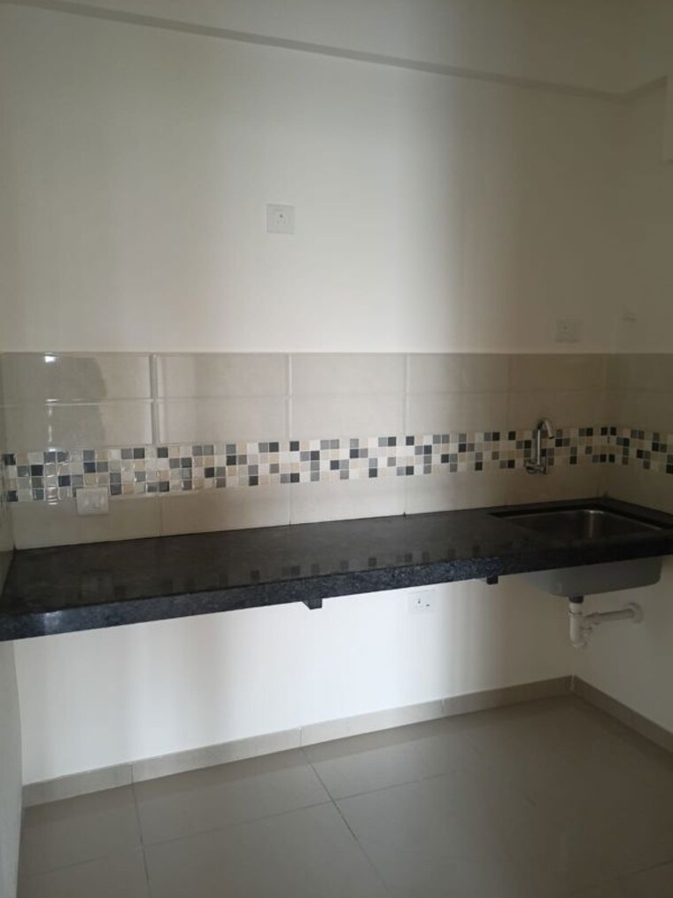Kitchen, mahindra-happinest-tathawade-phase-1 1 Bedroom 450 Sq.Ft. Apartment In Tathawade Pune 10561456