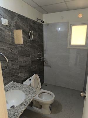 Bathroom in 3 BHK Apartment at Pardos Okas Residency, Sushant Golf City – for Rent