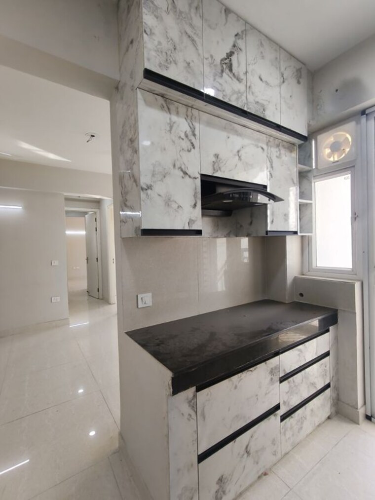 Kitchen, eldeco-live-by-the-greens 2 Bedroom 1137 Sq.Ft. Apartment In Sector 150 Noida 10562319