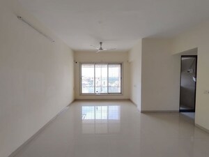 Living Room in 3 BHK Apartment at Romell Diva, Malad West – for Rent