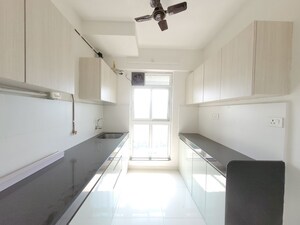 Kitchen in 2 BHK Apartment at Godrej Emerald, Ghodbunder Road – for Rent