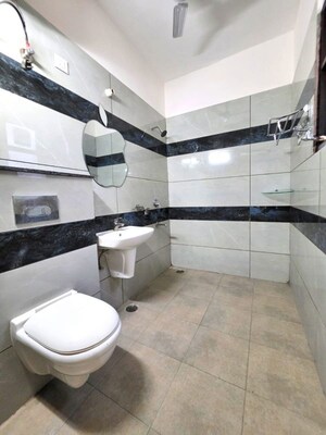 Bathroom in 4 BHK Apartment at Dhakoli – for Sale