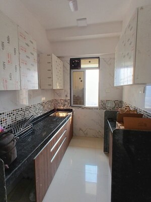 Kitchen in 2 BHK Apartment at DGS Sheetal Ekta, Malad East – for Rent