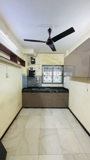 Kitchen in 2 BHK Apartment at Swapna Sangeet CHS, Mulund West – for Rent