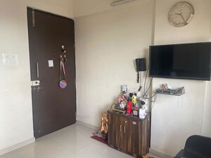 Living Room in 1 BHK Apartment at Satyam CHS Naupada, Naupada – for Sale