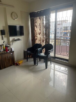 Living Room in 1 BHK Apartment at Satyam CHS Naupada, Naupada – for Sale