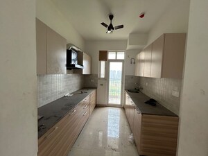 Kitchen in 3 BHK Apartment at ATS Homekraft Pious Hideaways, Sector 150 – for Rent