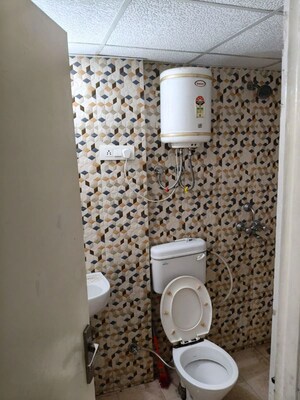 Bathroom in 2 BHK Apartment at Nilaya Greens, Raj Nagar Extension – for Rent