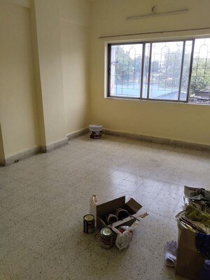Living Room in 1 BHK Apartment at Gita Society, Camp – for Rent