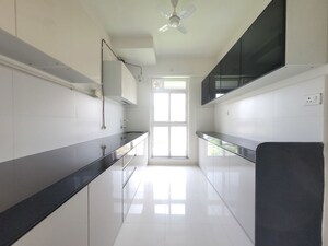Kitchen in 3 BHK Apartment at Godrej Emerald, Ghodbunder Road – for Rent