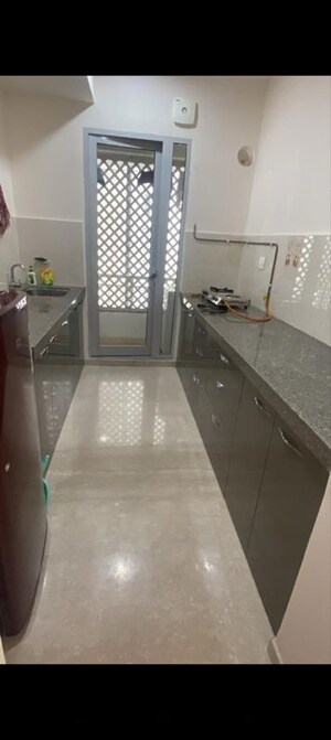 Kitchen in 2 BHK Apartment at Piramal Vaikunth, Balkum Pada – for Rent