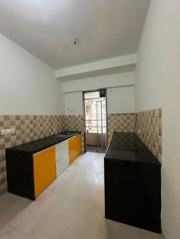 Kitchen, divine-aspen-garden 3 Bedroom 1121 Sq.Ft. Apartment In Goregaon East Mumbai 10565301