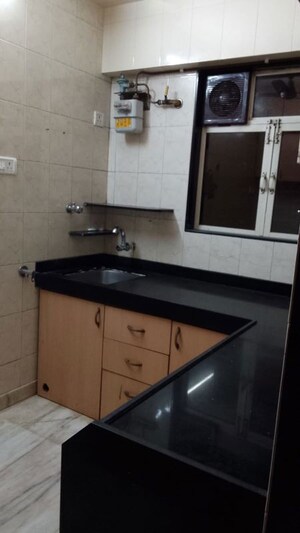 Kitchen in 1 BHK Apartment at Raheja Township, Malad East – for Rent