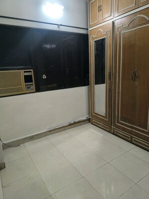 Bedroom in 1 BHK Apartment at Milind Madhura Tower, Amboli – for Rent