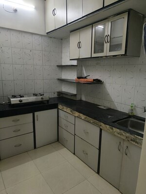 Kitchen in 1 BHK Apartment at Milind Madhura Tower, Amboli – for Rent