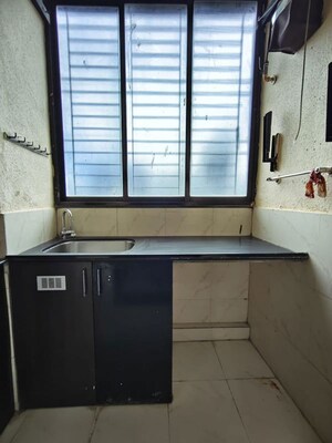 Kitchen in 2 BHK Apartment at K Raheja Heights, Malad East – for Rent