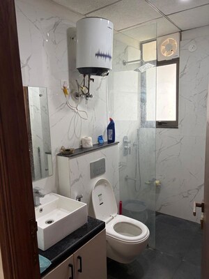 Bathroom in 3 BHK Apartment at Manglam 14 Woodland Park, Shiprapath – for Rent