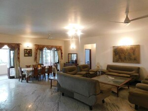 Living Room in 4 BHK Apartment at RMZ Woodsvale, Benson Town – for Sale