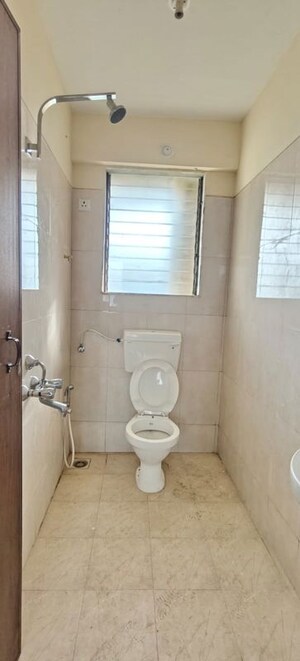 Bathroom in 1 BHK Apartment at Puranik City, Kasarvadavali – for Rent