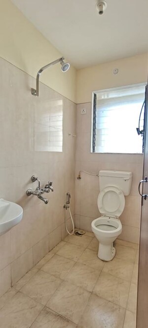 Bathroom in 1 BHK Apartment at Puranik City, Kasarvadavali – for Rent