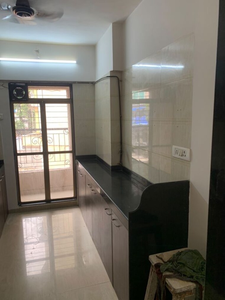 Kitchen, right-channel-trishul-heights 3 Bedroom 1000 Sq.Ft. Apartment In Kandivali West Mumbai 10566203