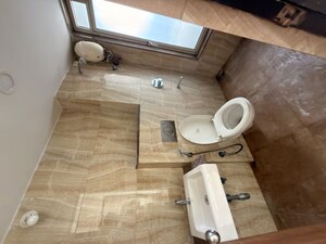 Bathroom in 1 BHK Apartment at Lodha Amara, Kolshet Road – for Rent