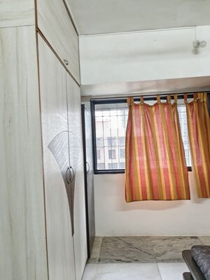 Bedroom in 2 BHK Apartment at Satellite Garden, Goregaon East – for Rent