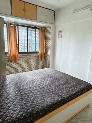 Bedroom in 2 BHK Apartment at Satellite Garden, Goregaon East – for Rent