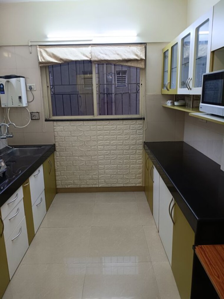 Kitchen, raheja-gardens 2 Bedroom 1200 Sq.Ft. Apartment In Wanwadi Pune 10567790