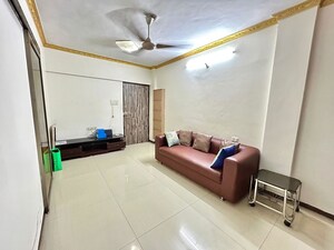 Living Room in 1 BHK Apartment at Lokhandwala Complex – for Rent