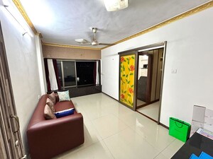 Living Room in 1 BHK Apartment at Lokhandwala Complex – for Rent