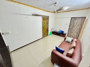 Living Room in 1 BHK Apartment at Lokhandwala Complex – for Rent