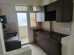 Kitchen in 2 BHK Apartment at Amrapali Silicon City, Sector 76 – for Rent