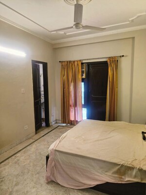 Bedroom in 3 BHK Builder Floor at Nehru Enclave – for Rent
