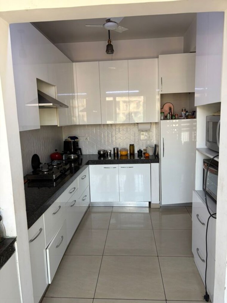 Kitchen, griha-pravesh 3 Bedroom 1726 Sq.Ft. Apartment In Sector 77 Noida 10568316