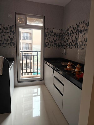 Kitchen in 1 BHK Apartment at Raunak Bliss, Ghodbunder Road – for Rent