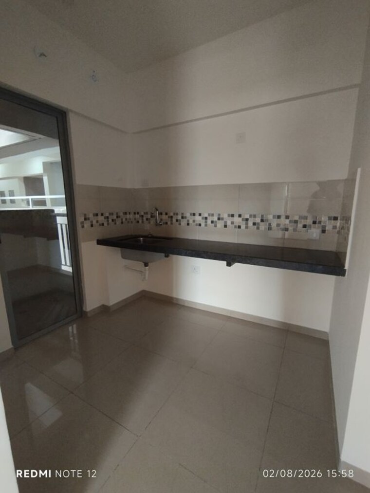 Kitchen, mahindra-happinest-tathawade-phase-1 1 Bedroom 800 Sq.Ft. Apartment In Tathawade Pune 10568670