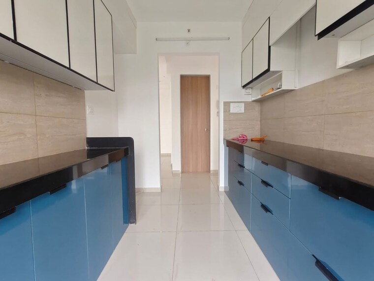 Kitchen, godrej-emerald 2 Bedroom 811 Sq.Ft. Apartment In Ghodbunder Road Thane 10568673