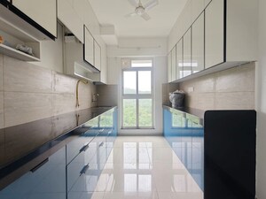 Kitchen in 2 BHK Apartment at Godrej Emerald, Ghodbunder Road – for Rent