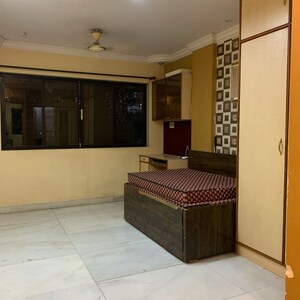 Living Room in 2 BHK Apartment at Yogananda CHS, Borivali West – for Rent