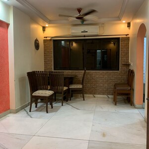 Living Room in 2 BHK Apartment at Yogananda CHS, Borivali West – for Rent