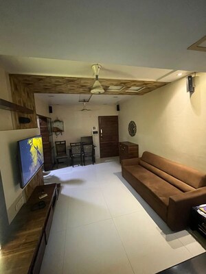 Living Room in 1 BHK Apartment at Lokhandwala Whispering Palms, Kandivali East – for Sale