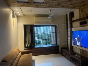 Living Room in 1 BHK Apartment at Lokhandwala Whispering Palms, Kandivali East – for Sale