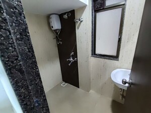 Bathroom in 2 BHK Apartment at Lotus Unity, Versova – for Rent
