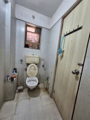 Bathroom in 1 BHK Apartment at Iris CHS, Kasarvadavali – for Rent