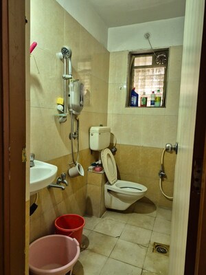 Bathroom in 1 BHK Apartment at Iris CHS, Kasarvadavali – for Rent