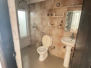 Bathroom in 3 BHK Apartment at Mahagun Moderne, Sector 78 – for Rent