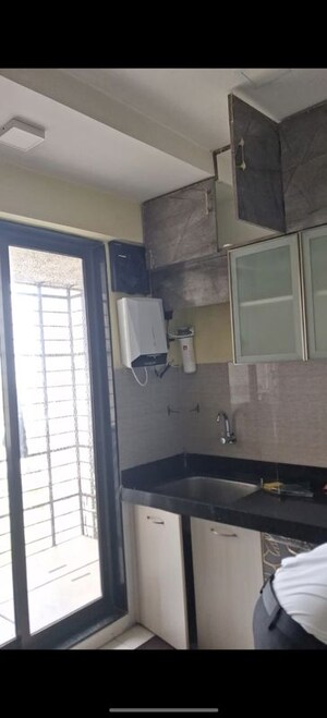 Kitchen in 2 BHK Apartment at Acme Avenue, Kandivali West – for Rent
