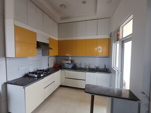 Kitchen in 4 BHK Apartment at Mahagun Moderne, Sector 78 – for Rent