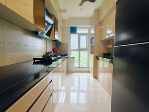 Kitchen in 3 BHK Apartment at Godrej Emerald, Ghodbunder Road – for Rent
